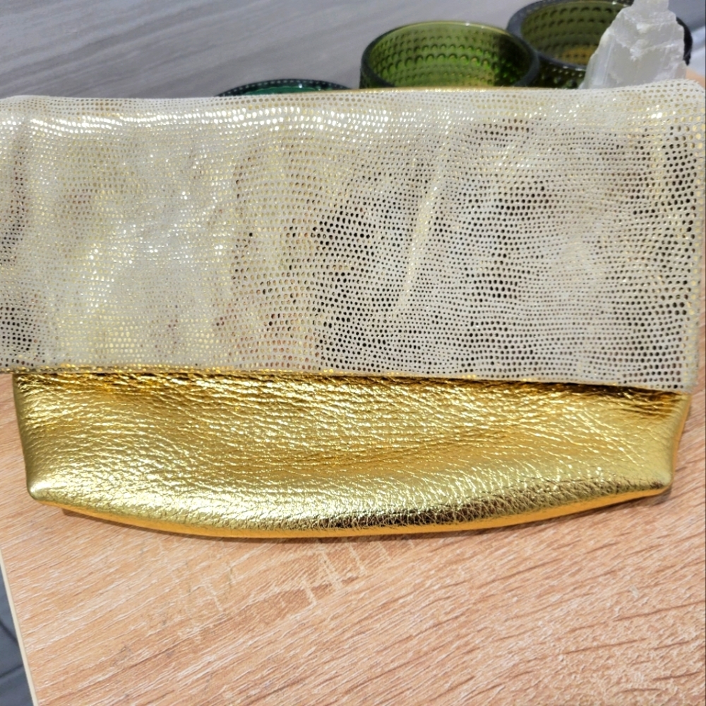 Beautiful and brand new Gold Leather fold-over Clutch